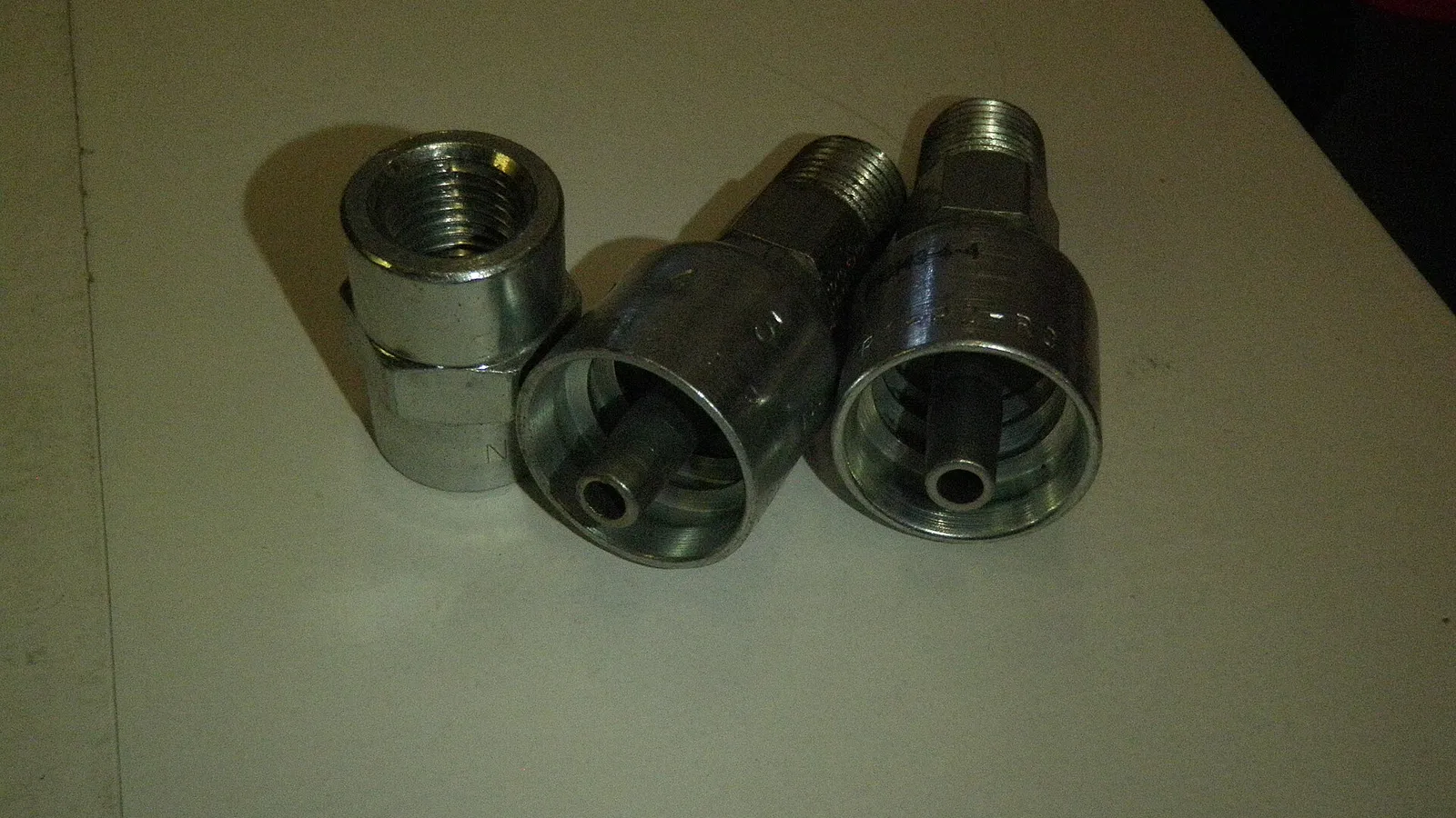 Stainless threaded hose fittings on workbench