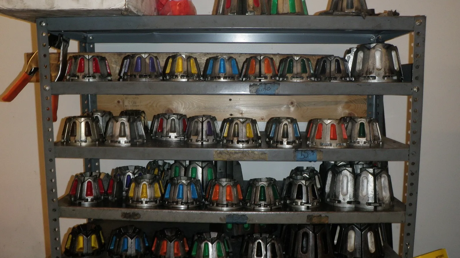 Bins of hose fittings and couplings in a warehouse