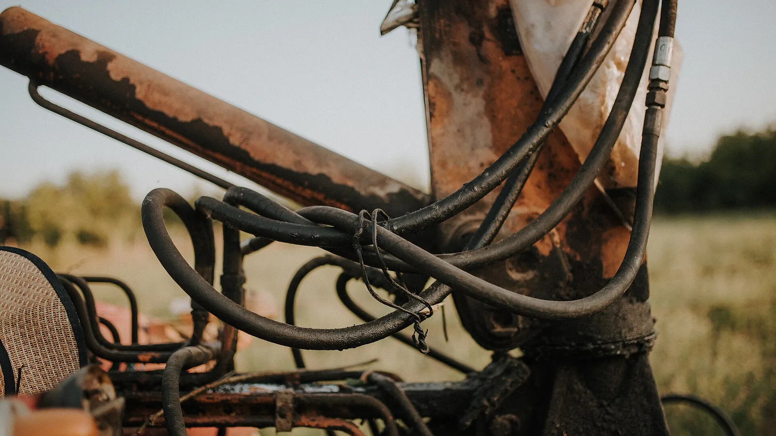 Crimped hydraulic hose assemblies mounted on equipment