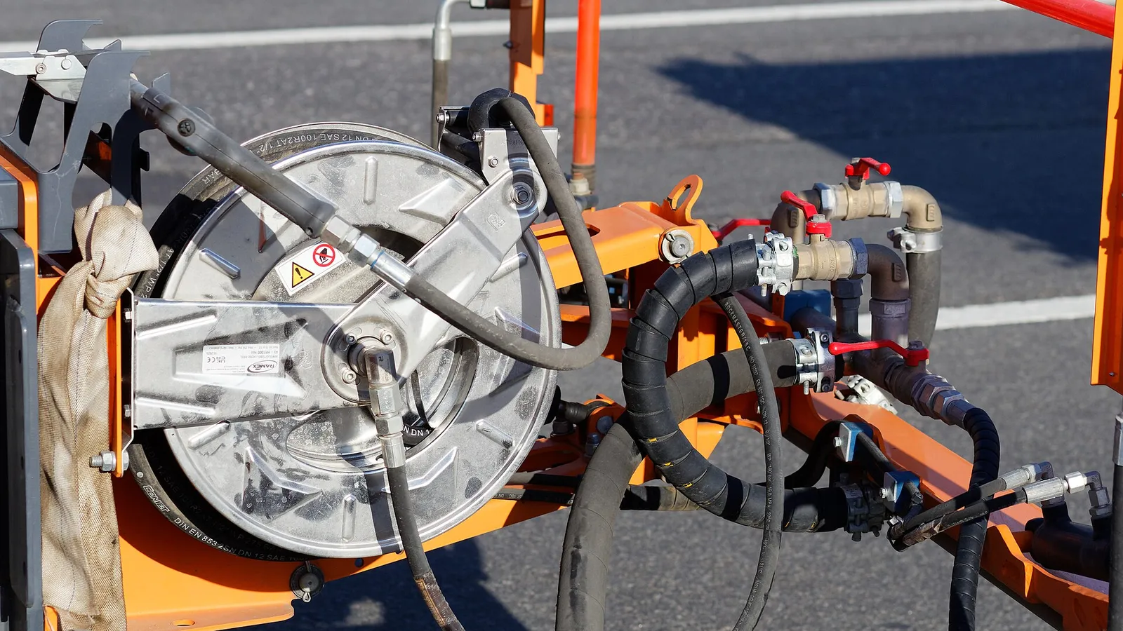 High pressure hydraulic hose on orange reel with quick couplings